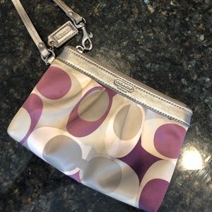 Coach plum and silver mini clutch.